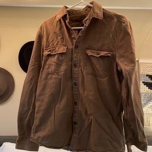 Brown canvas material button up with plaid inside